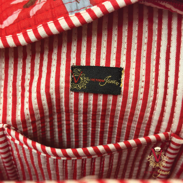 Red Bird Zipped Designer Carry All Tote Bag close up label